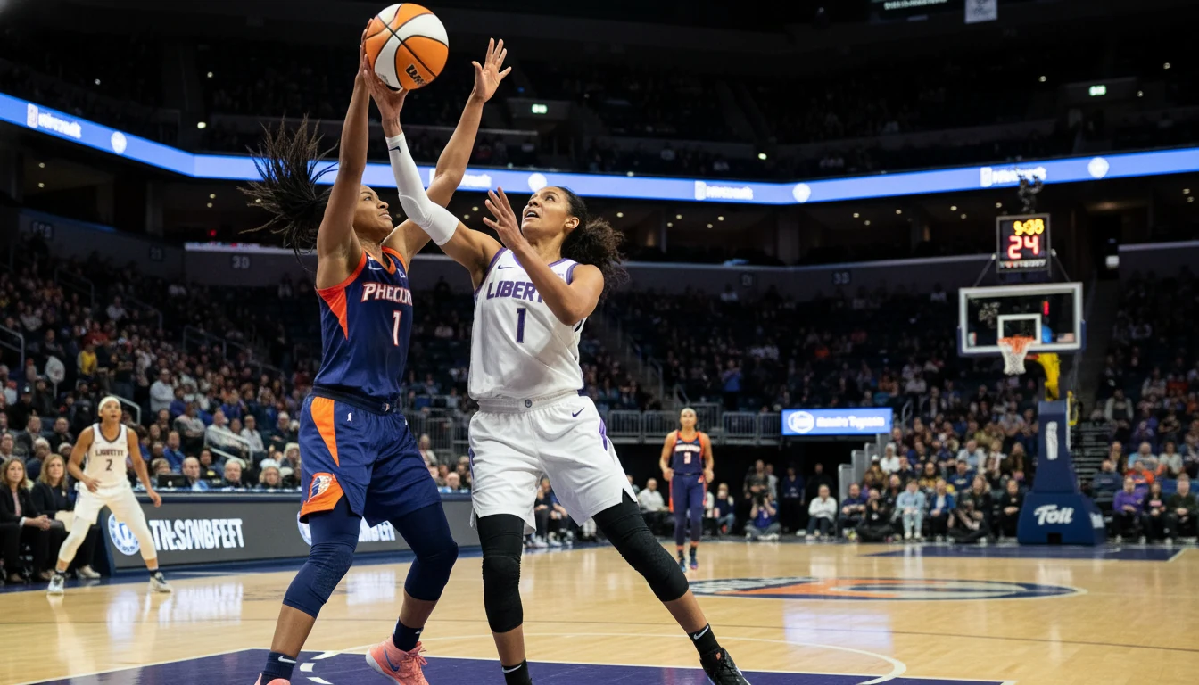 Women's basketball game action shot with players on indoor court